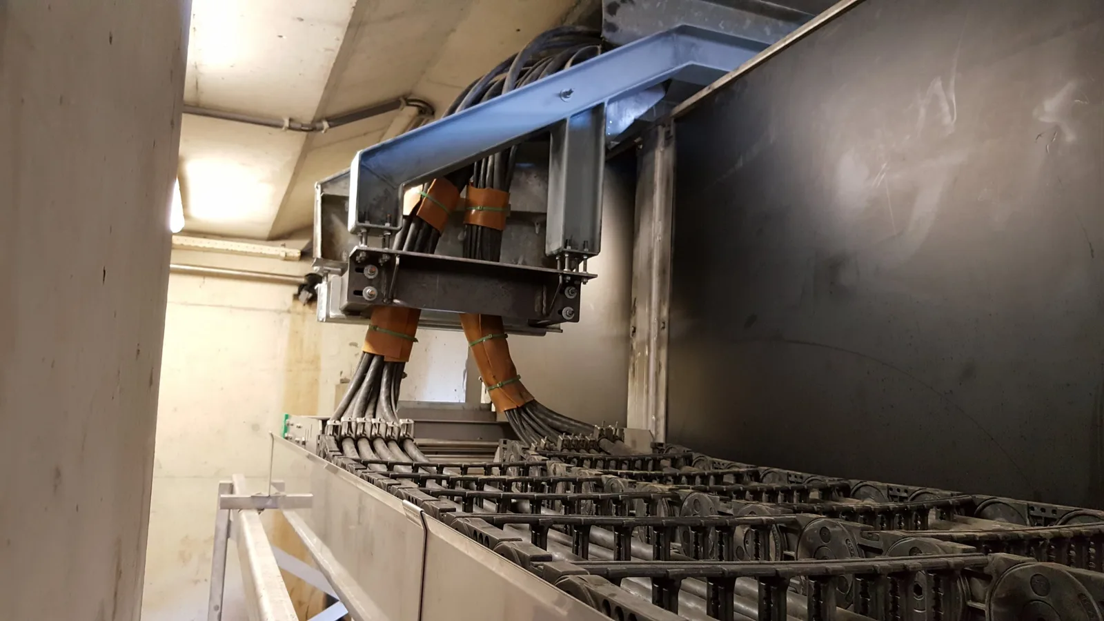 The fixed end of the carriers, with strain-relieved cables