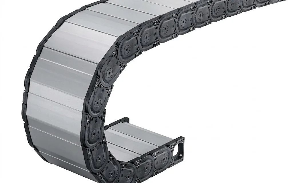 Black cable carrier with grey aluminium crossbar dividers in a bend